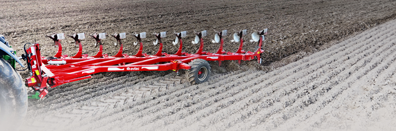 11 furrow Ovlac Mini shallow plough working in field