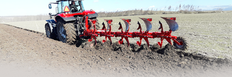 Ovlac Classic 5 furrow plough ploughing behind a Massey Ferguson tractor